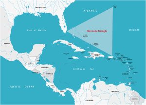 Map showing the Bermuda Triangle area in the Atlantic Ocean, marked by a shaded triangle between Miami, Bermuda, and Puerto Rico, with surrounding countries and seas labeled.